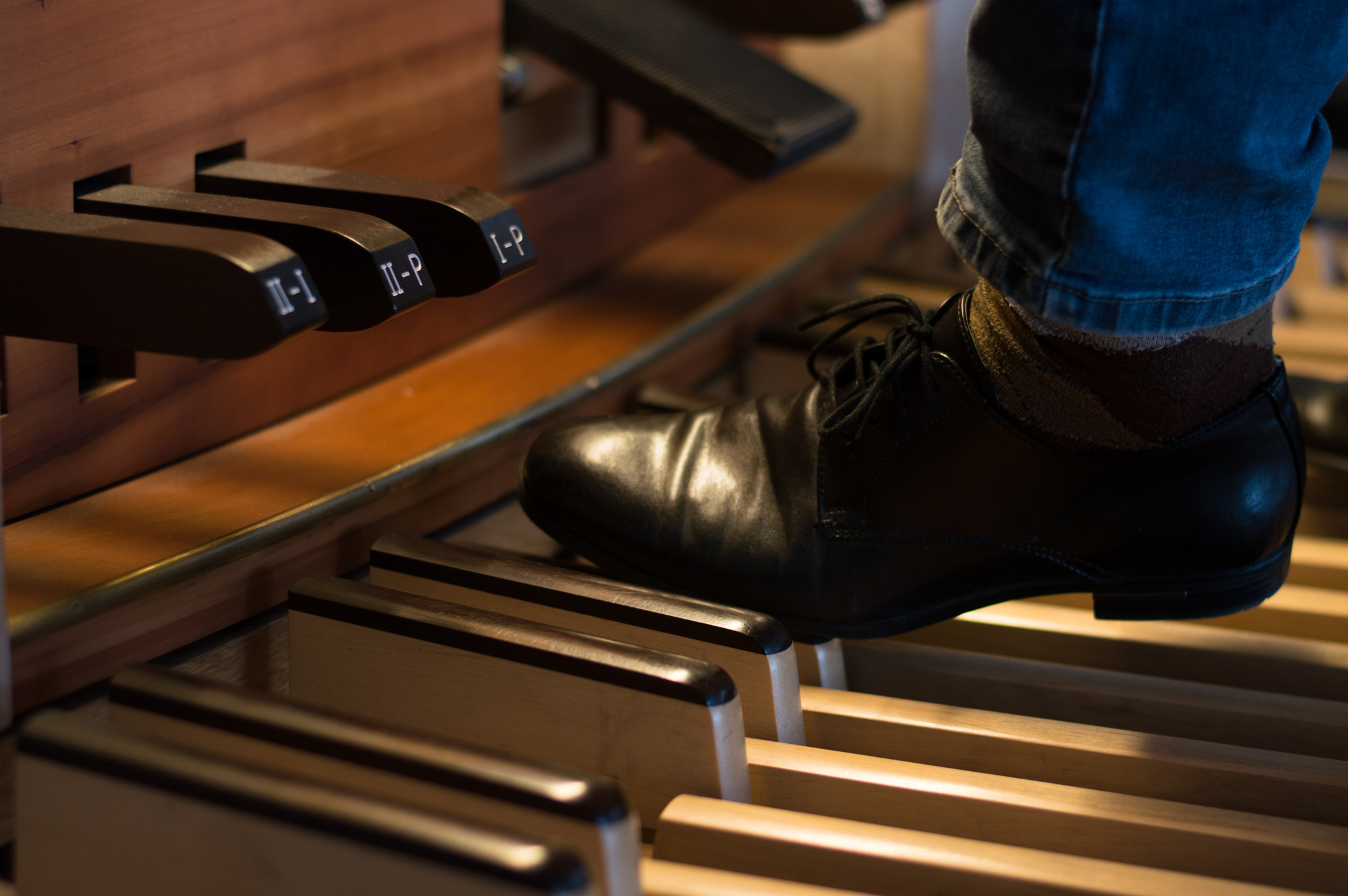 Organ playing on pedals close up